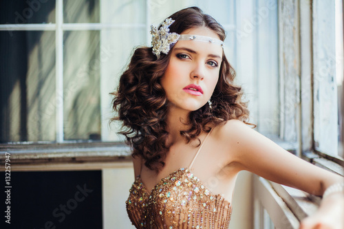 Fashion photo of beautiful girl wearing sparkling evening dress