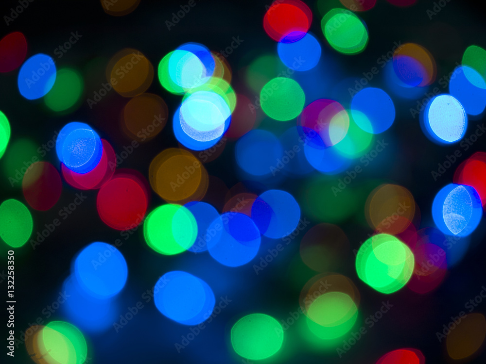 Colorful Christmas lights bokhe on black