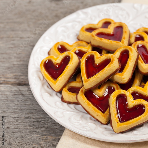 Cherry Hearts. Shortbread Cookies with Cherry Fruit Filling and Chocolate Base. Selective focus