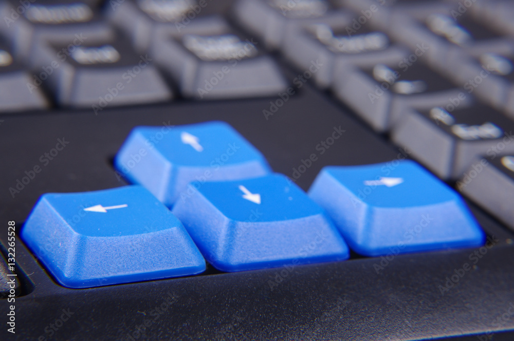 Blue arrow buttons on the computer keyboard Blue arrow buttons on the computer keyboard