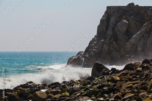 Rocky beach with waves crashing