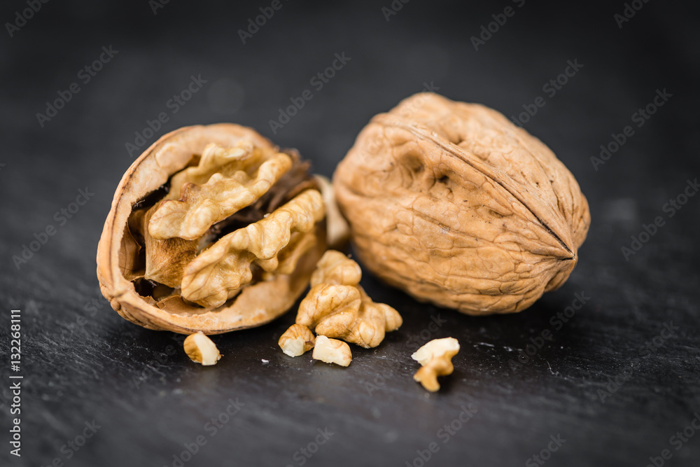 Portion of Whole Walnuts on a slate slab Portion of Whole Walnuts on a slate slab