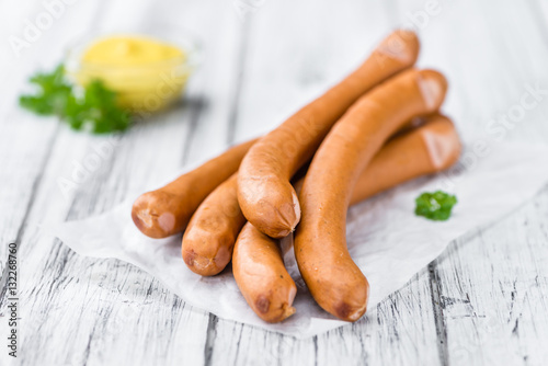 Sausages (Frankfurter) on vintage wooden background
