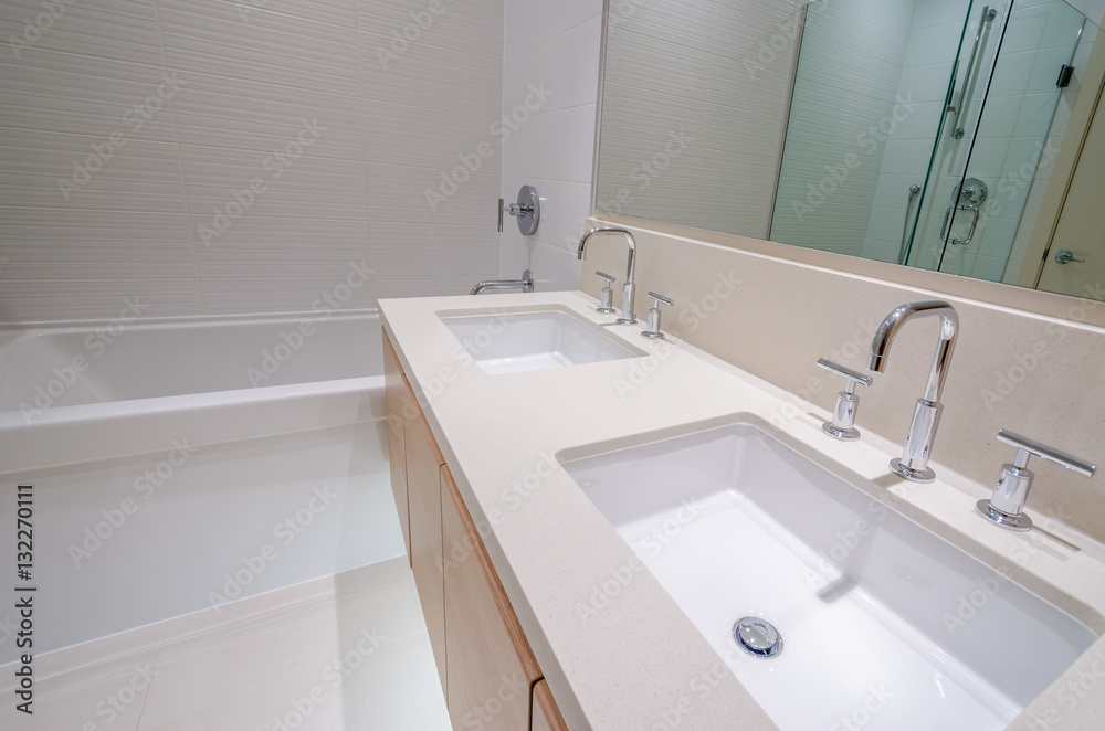 Modern bathroom interior with bathtub and two sinks. Modern bathroom interior with bathtub and two sinks.