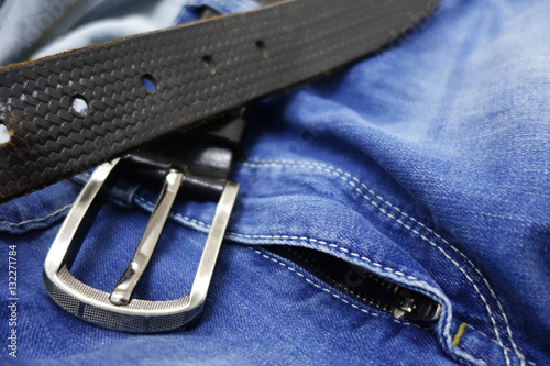 Blue jeans with black leather belt