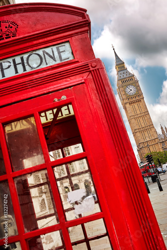 London - Big Ben tower and a red phone booth