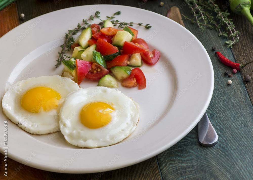 Appetizing fried eggs for breakfast. Fried eggs with herbs Appetizing fried eggs for breakfast. Fried eggs with herbs