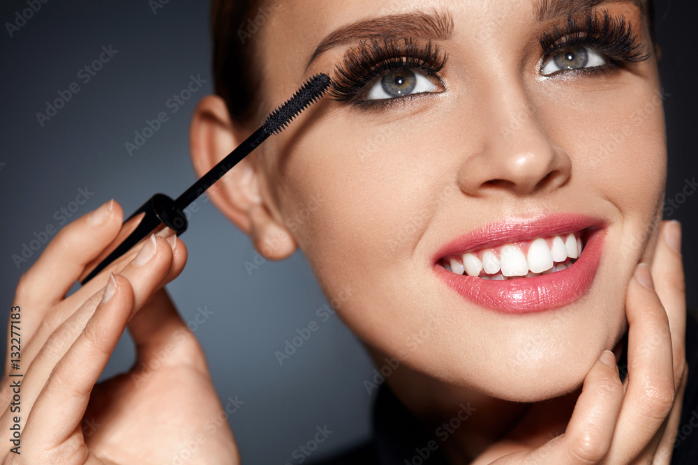 Woman With Perfect Makeup, Long Black Eyelashes Applying Mascara