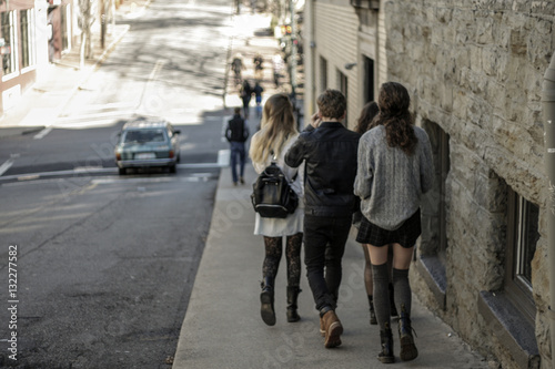 Teenagers Walking Down Street