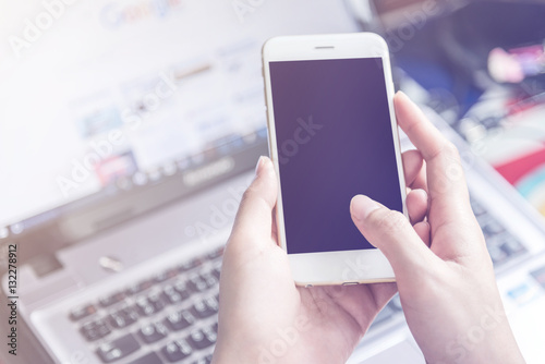 hand holding using mobile phone.girl using smart phone.
