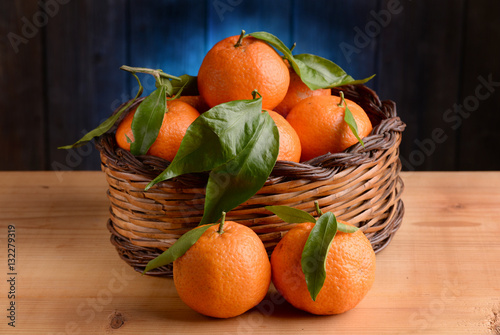 Clementines in a basket on table
