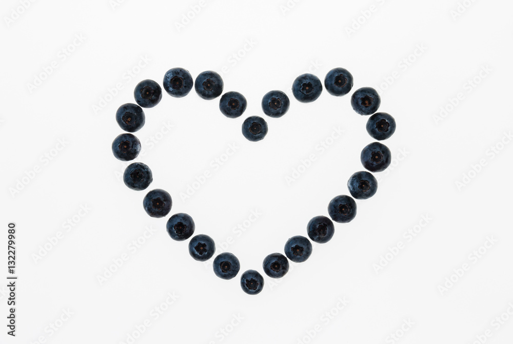 closeup of isolated blueberry heart on white background closeup of isolated blueberry heart on white background