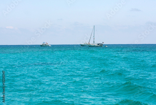 Florida Keys turquoise water in the coral diving area. Boats waiting for divers. Horizontal composition.