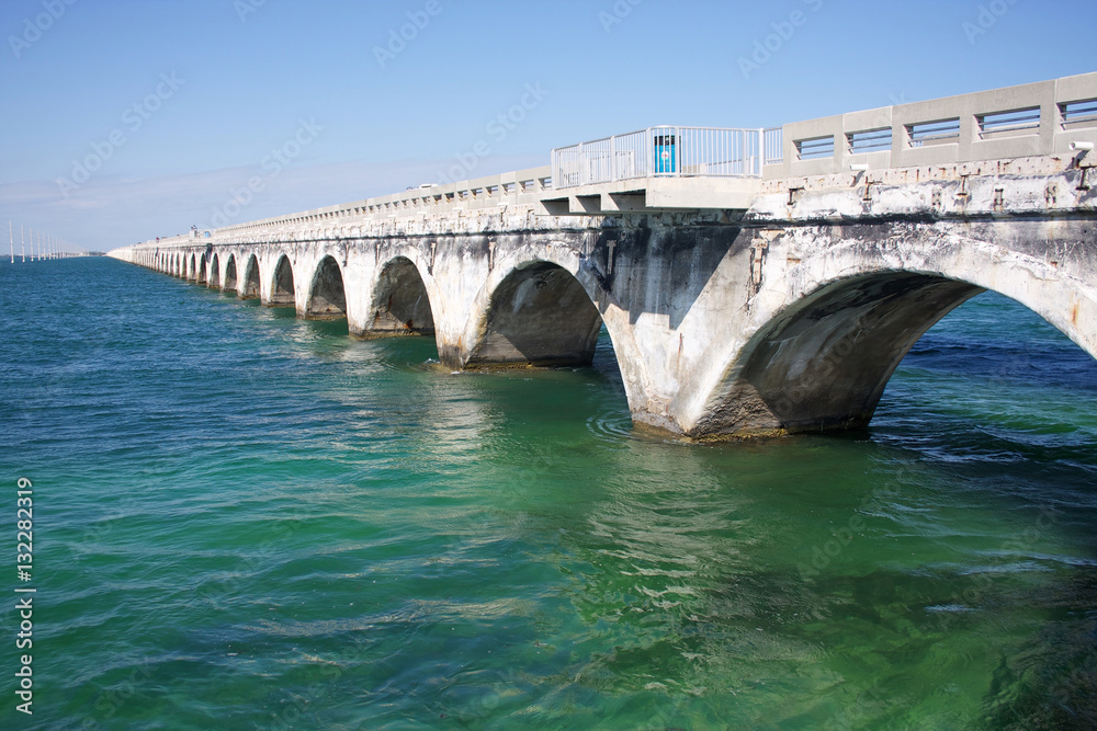 Old historical seven mile bridge, connected Florida Keys over turquoise caribbean water. The bridge allowed for pedestrians in some areas.