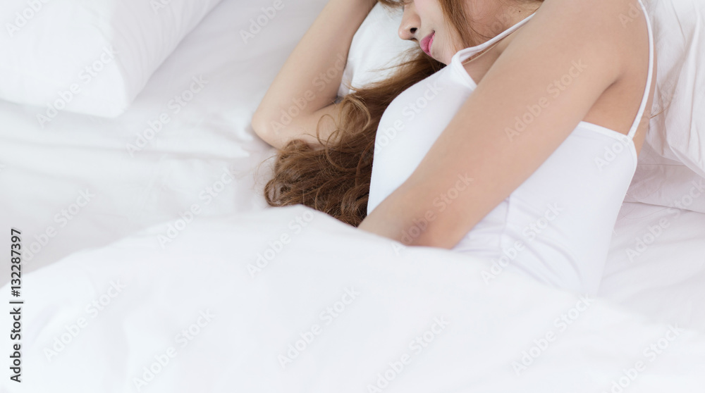 young beautiful woman sleeping on bed