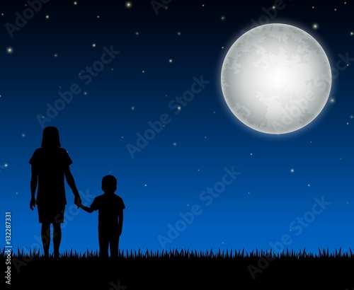 Silhouette of mother and child on the night background