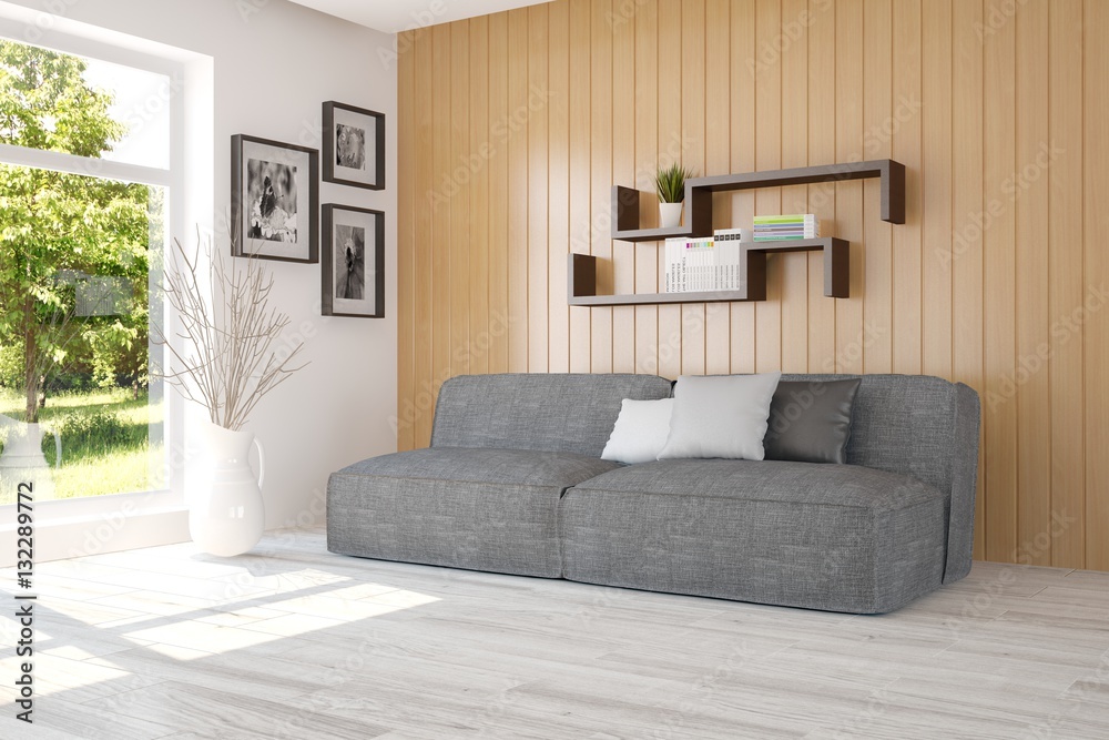 Obraz premium White room with sofa and green landscape in window. Scandinavian interior design