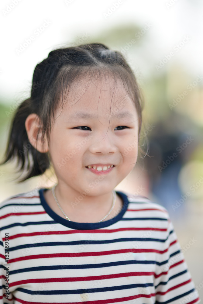 Closeup smiling little girl, Outdoor potrait Closeup smiling little girl, Outdoor potrait