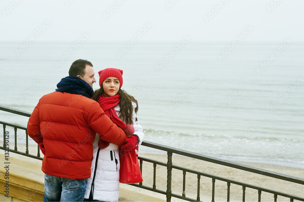 Young loving couple on a walk , dressed in bright clothes Young loving couple on a walk , dressed in bright clothes