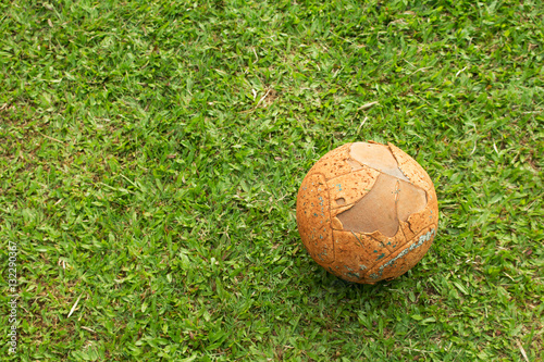 The old soccer ball on soccer field.