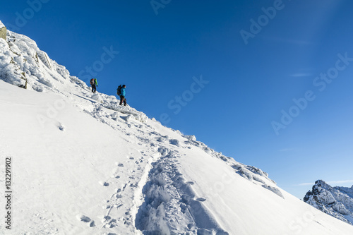 Tourists on a snowy slope.