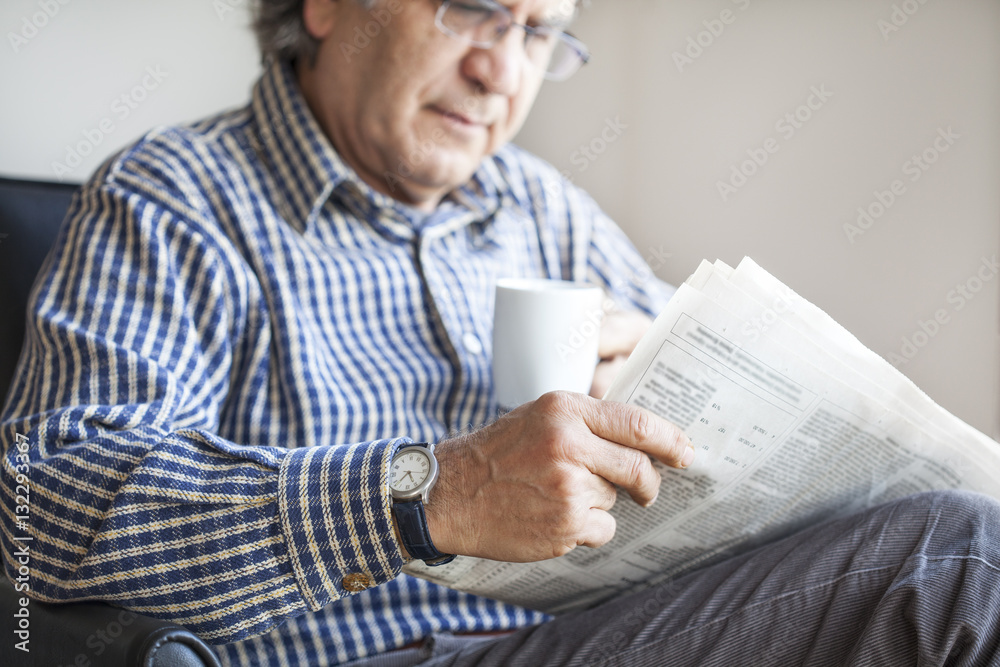 Senior man reading newspaper Senior man reading newspaper