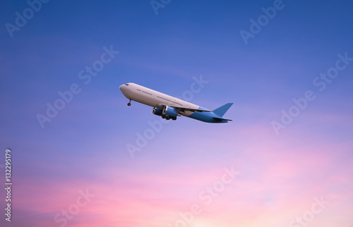 flying airplane on twilight sky