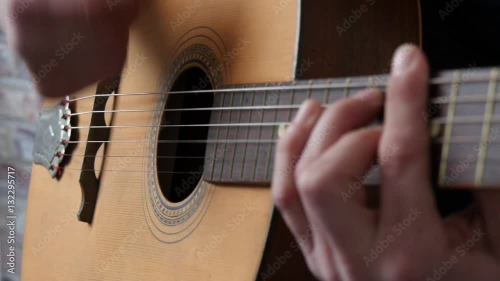 man's hands playing acoustic guitar, close up man's hands playing acoustic guitar, close up