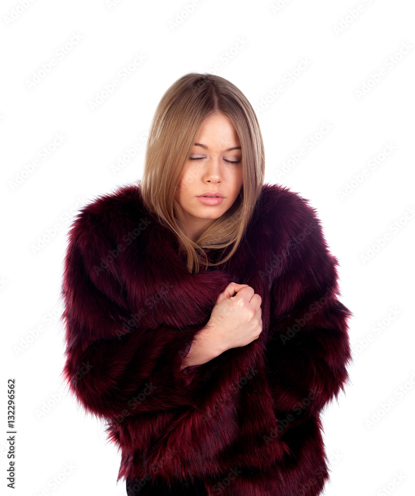 Attractive blonde woman with cold wearing a red fur coat Attractive blonde woman with cold wearing a red fur coat