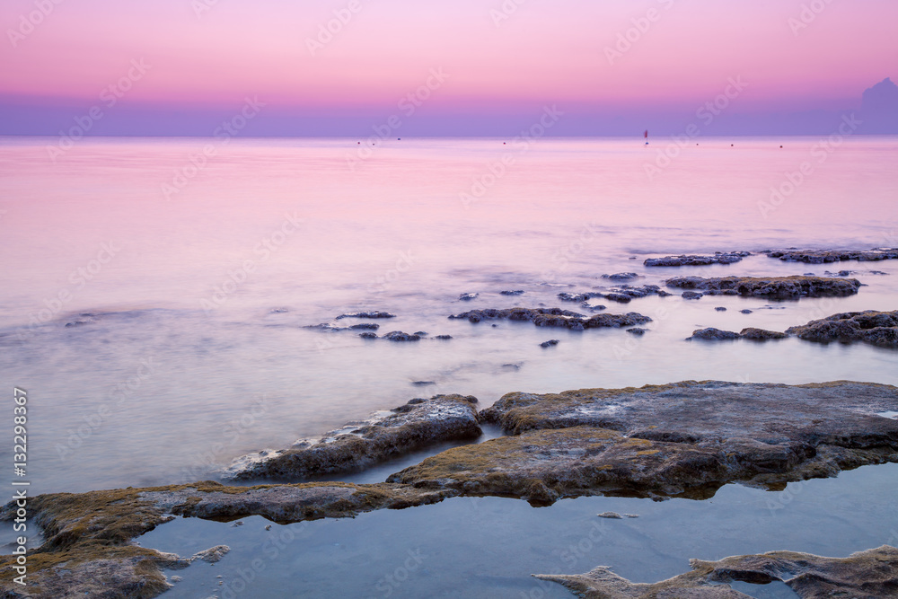 Fototapeta premium Early morning, pink sunrise over the sea
