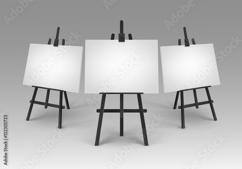 Set of Black Wooden Easels with Mock Up Empty Blank Canvases Isolated on Background