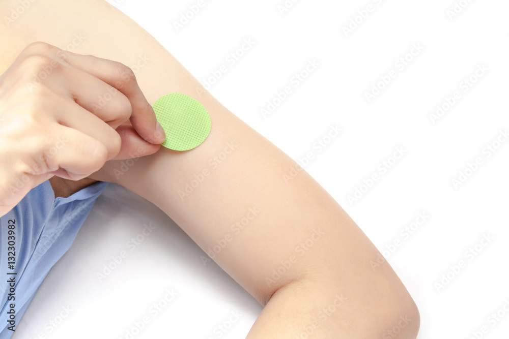 Stick anti mosquito patch on arm, on white background isolated