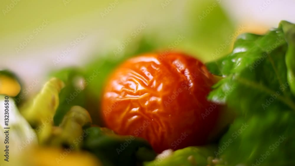 Tomato put hands in the salad. Macro. Tomato put hands in the salad. Macro.