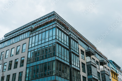modern office or apartment building with glass front in the corner