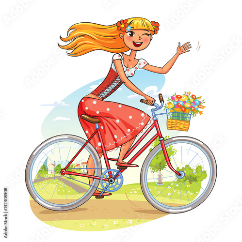 Beautiful girl rides a bicycle and waving