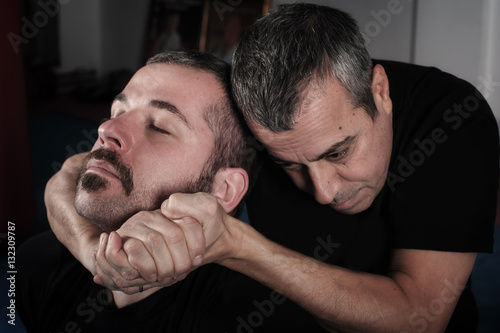 Kapap instructor demonstrates choke techniques photo