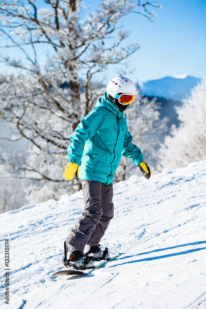 Snowboarder skating in the mountains with deep blue sky Snowboarder skating in the mountains with deep blue sky