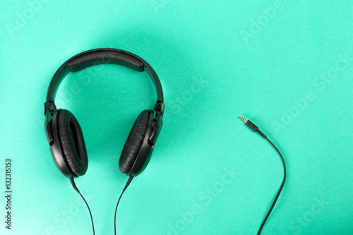 Headphones on green background