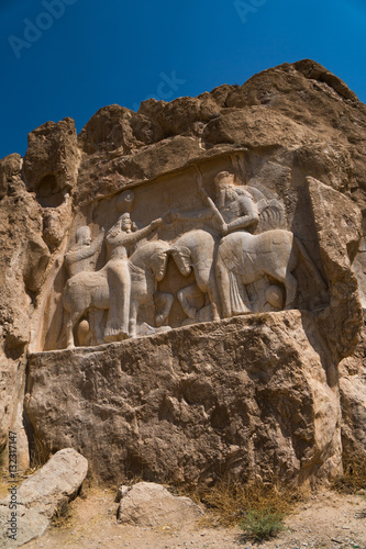Carved relief of the Investiture of Ardashir I, 224-239 AD, Naqsh-e Rostam Necropolis, near Persepolis, Iran photo