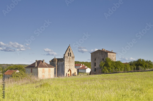 The church, reportedly owned by the Knights Templar, and old priory in Sainte Croix de Beaumont, Dordogne, France photo