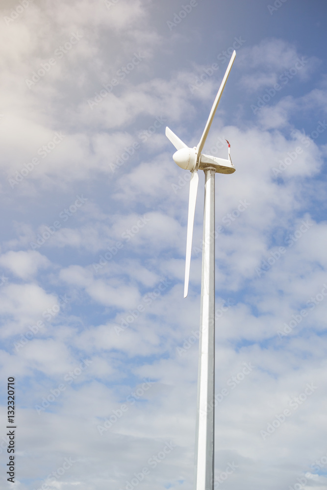 wind turbine for alternative energy on blue sky for background. wind turbine for alternative energy on blue sky for background.