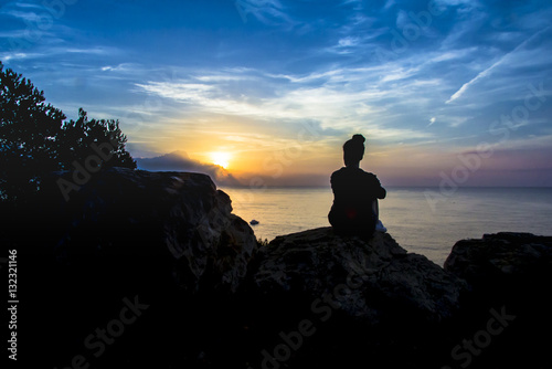 Silhouette of girl at sunrise
