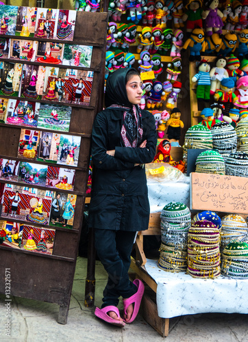 Streetwise vendor of local skullcaps and dolls, Masuleh, Iran photo