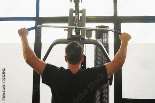 Man in a gym doing weight lifting