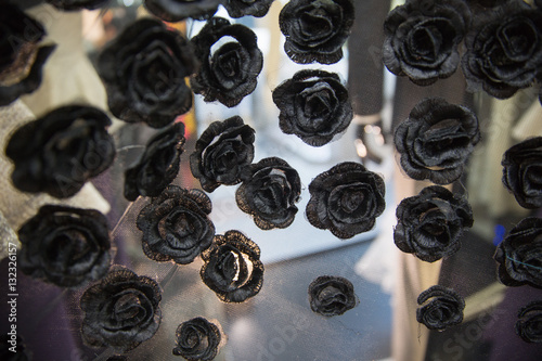 Transparent material with black rose flower details, texture for designing background, pattern