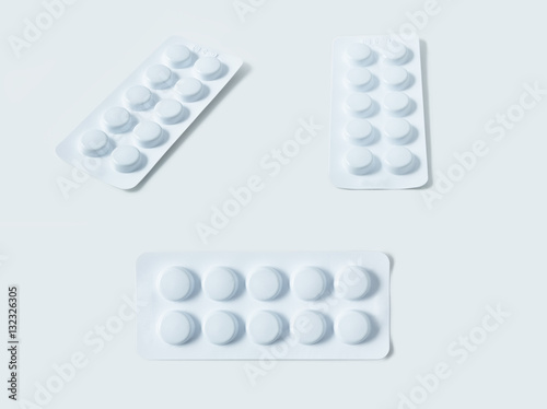 Aluminium blister pack of pills. The capsules are packaged in blisters, isolated on a white background. Disease. Flu. Medications.
