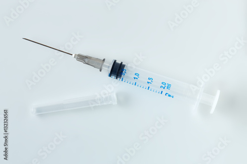 Disposable syringe isolated on white background.
