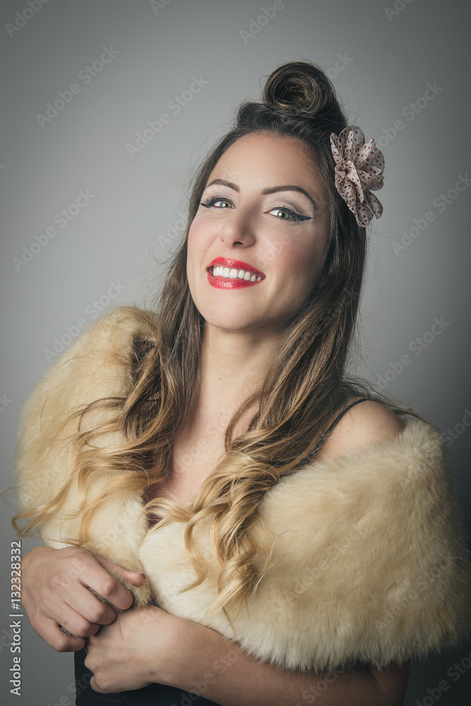 Smiling young woman in fashionable fur wrap Smiling young woman in fashionable fur wrap