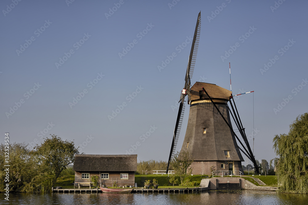 Stone brick Dutch windmill at Kinderdijk, an UNESCO world herita