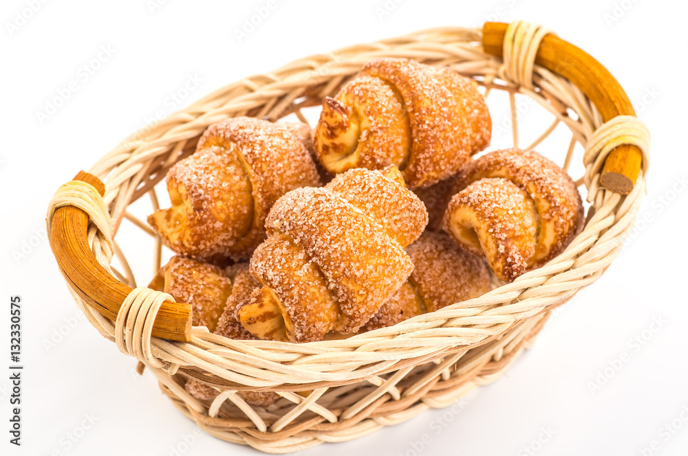 pile of fresh and delicious croissants on a white background
